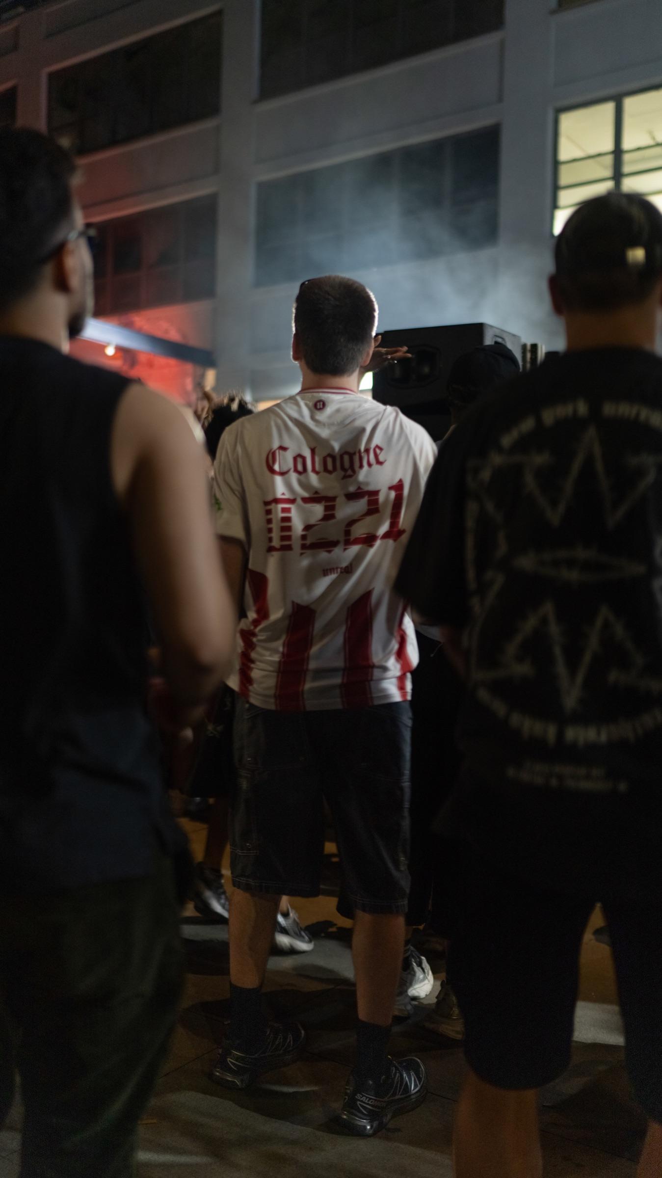 Dancers facing the booth, seen from behind