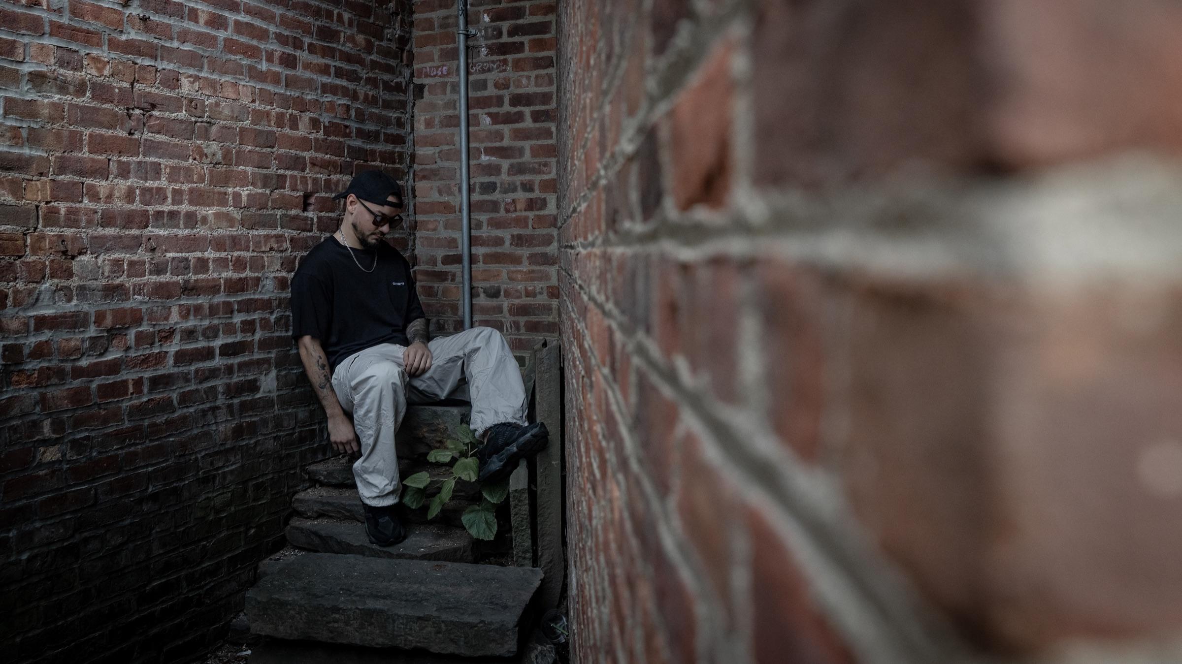 Medina on the alley steps, framed by brick