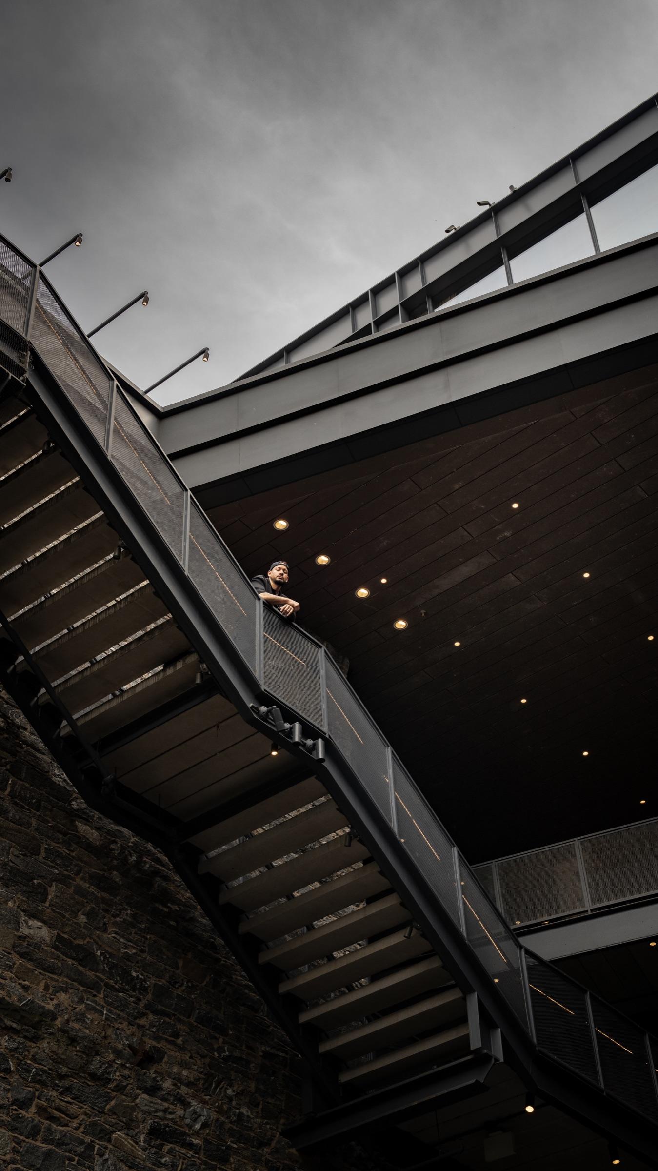 Medina small on a staircase under a concrete overhang