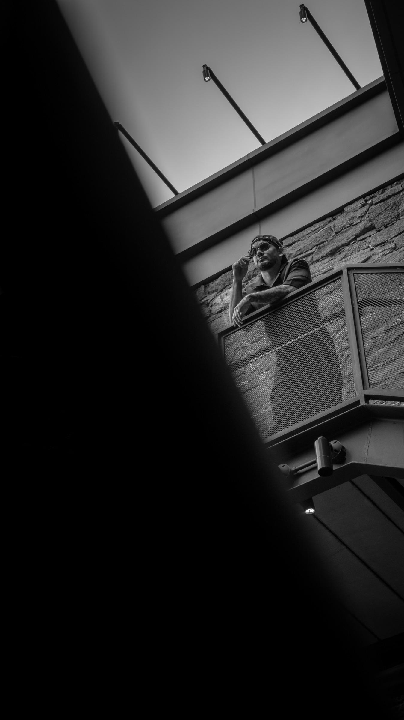 Black-and-white: Medina on a balcony seen from below