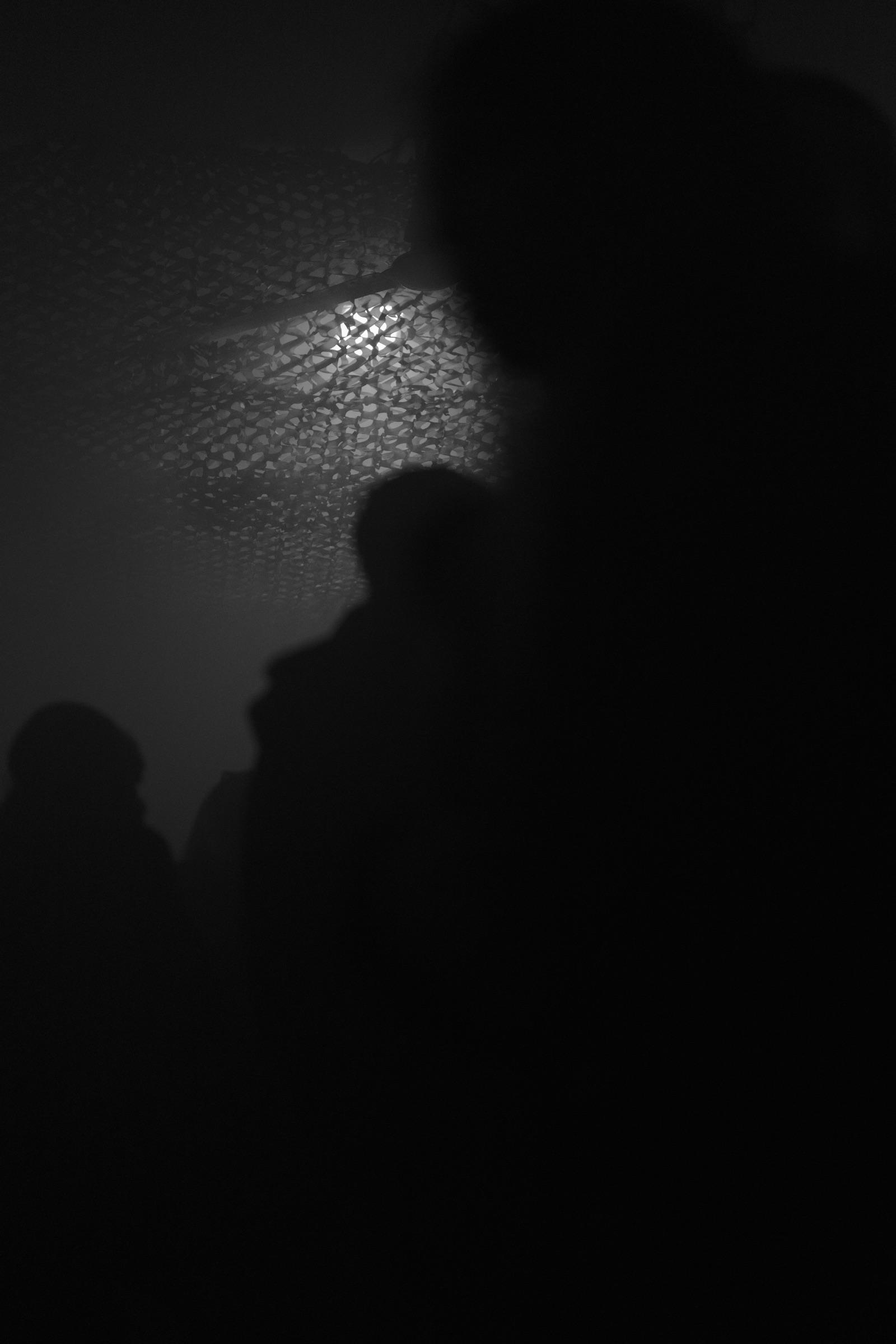Figures in thick haze near the dance floor