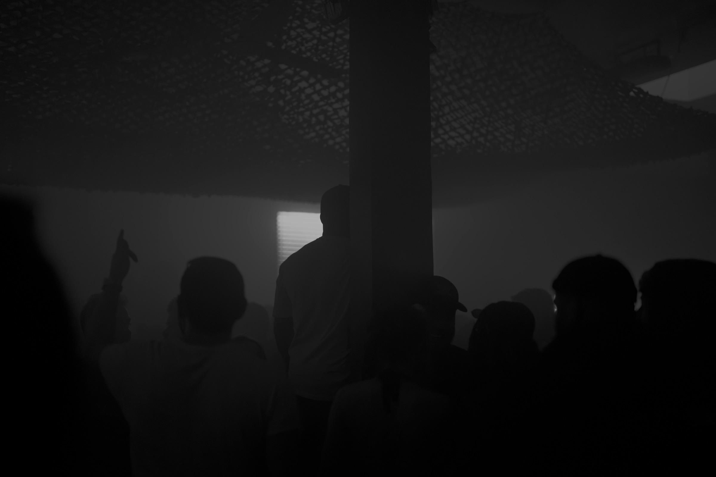 Wide view of the crowd in grey fog