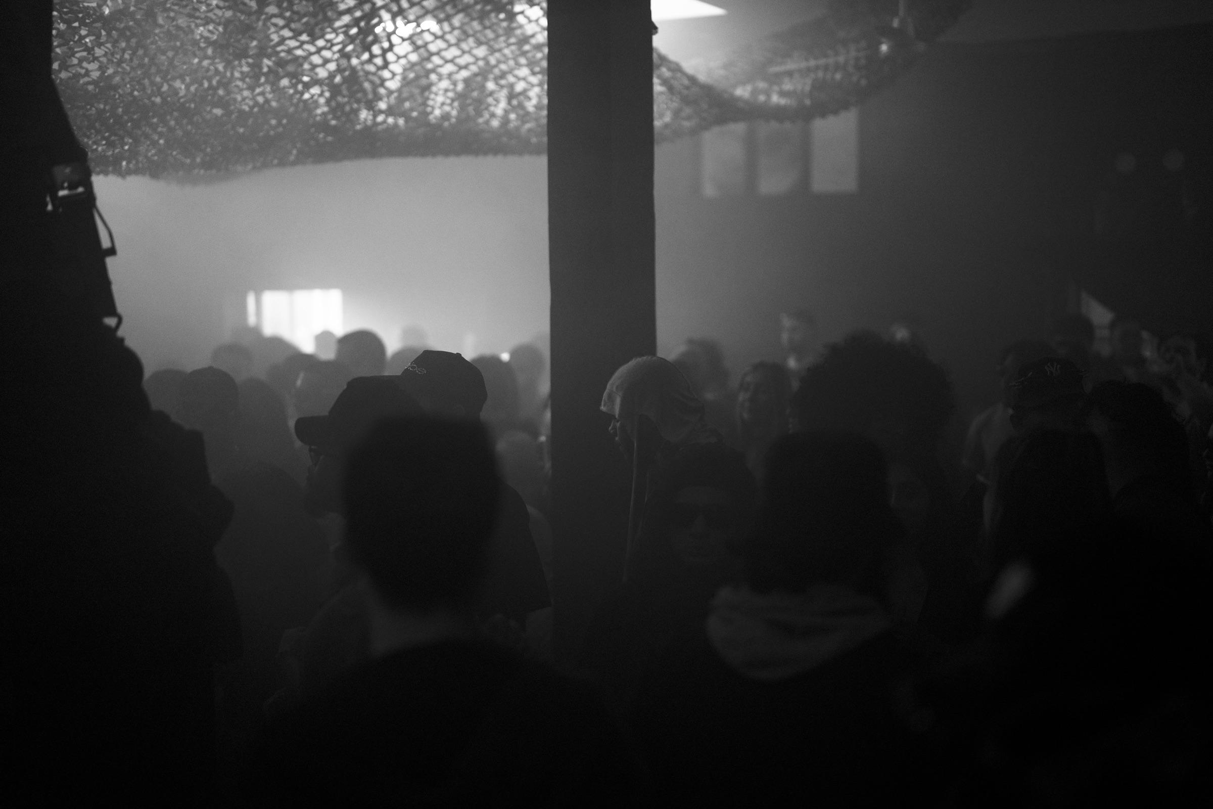 Wide view of the crowd under a mesh ceiling